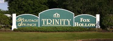 Entrance sign to Trinity, Florida highlighting RexPest's local pest control services