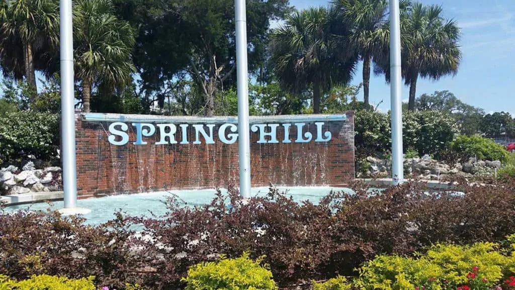 Spring Hill, Florida entrance sign highlighting RexPest's home base and local pest control services